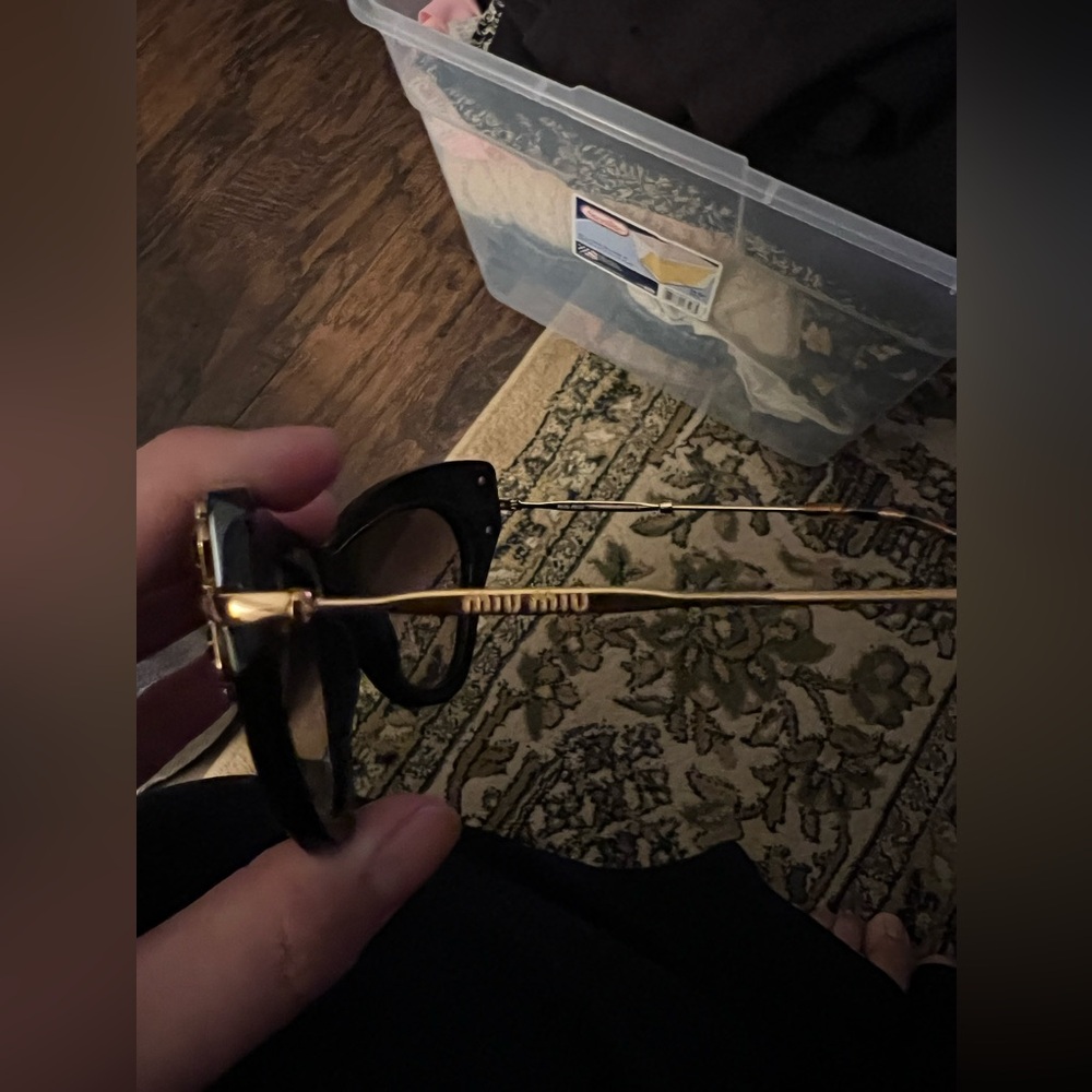 Miu Miu Black and Gold Sunglasses